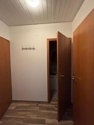 an empty room with a door and a toilet at See You 2 in Germersheim