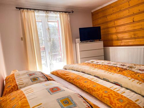 Ένα ή περισσότερα κρεβάτια σε δωμάτιο στο Apartmán u Paliho