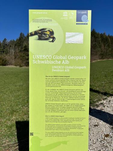 a sign in a field with a monkey on it at Atemberaubender Ausblick mit Premium-Wanderwegen vor der Haustür in Albstadt