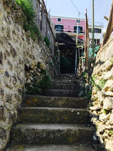 a set of stairs leading up a stone wall at Casa Rossa in Ravello