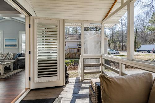 a screened in porch with a view of a house at Renovated 3-Bedroom, 2-Bath Home in Ocean Pines Peaceful Retreat Near Ocean City in Berlin