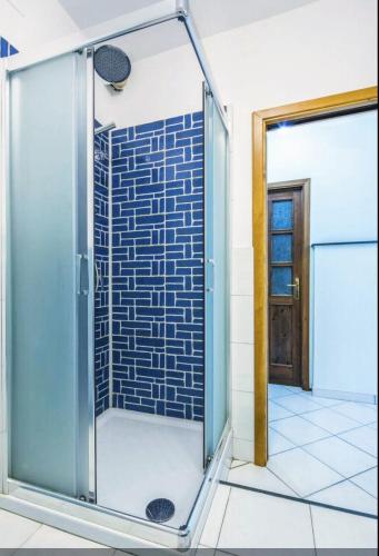 a shower with a glass door in a bathroom at Villa Lena in Conca dei Marini