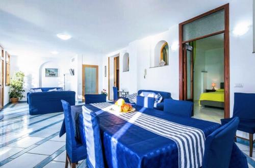 a blue room with a table and blue chairs at Villa Lena in Conca dei Marini