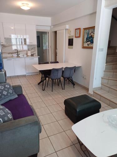 a living room with a couch and a table at SUNNY COAST in Paralimni
