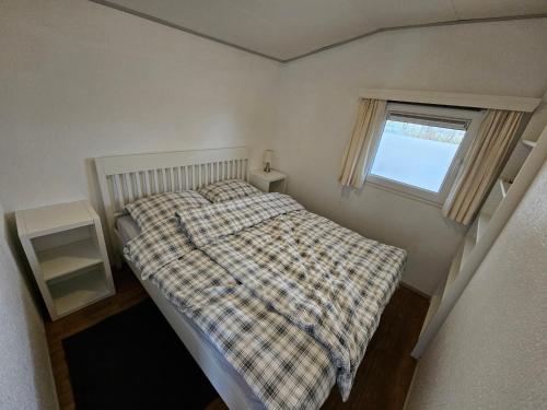 Postel nebo postele na pokoji v ubytování Chalet in Lauwersoog