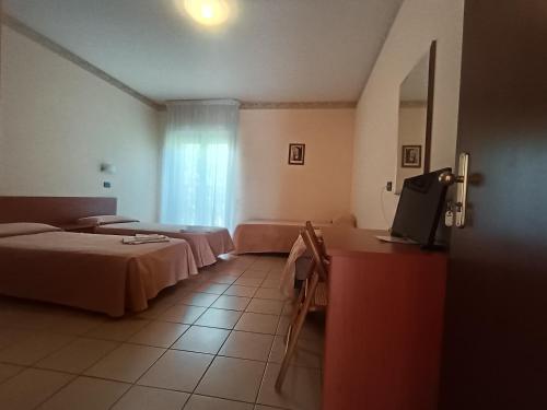 Postel nebo postele na pokoji v ubytování Hotel Sirios