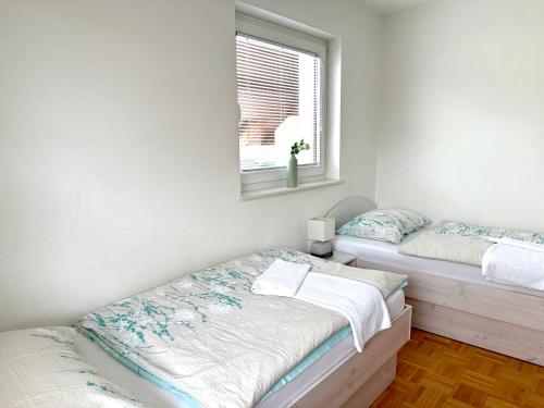 Ένα ή περισσότερα κρεβάτια σε δωμάτιο στο Guest house Kobal