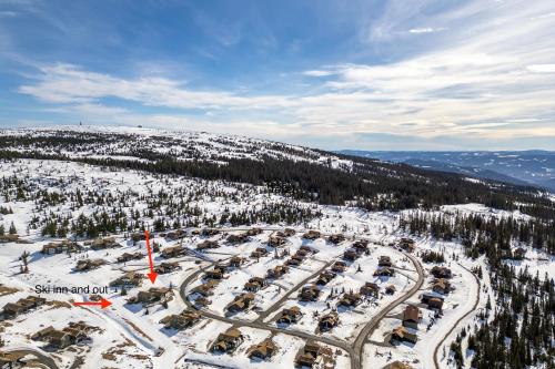 an aerial view of a parking lot in the snow at Nordic Gateway Logde in Hafjell