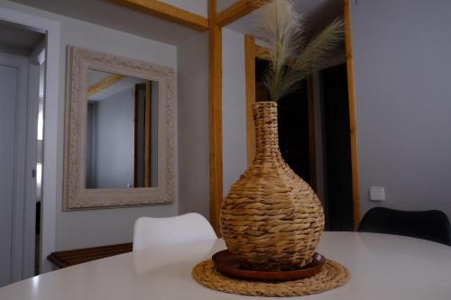 a vase sitting on a table in a room at Apartamento Homely Foratata in Formigal