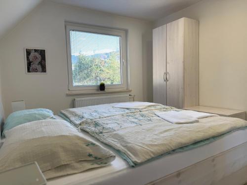Ένα ή περισσότερα κρεβάτια σε δωμάτιο στο Guest house Kobal
