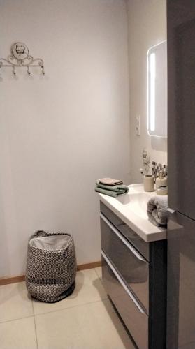 a bathroom with a sink and a counter top at Les Remparts in Caudiès-de-Fenouillèdes