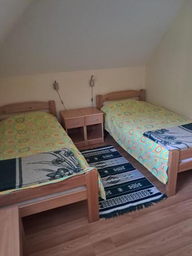 Postel nebo postele na pokoji v ubytování Vikendica Obradović