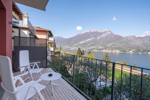 a balcony with chairs and a view of the water at Borgo Le Terrazze in Bellagio