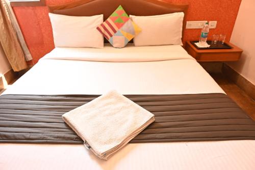 a pair of beds in a hotel room at Bella Vagues By K Hotels in Chennai