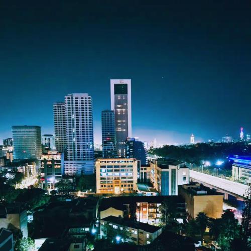 a city skyline at night with tall buildings at Urban Vibes Getaways - Premium Westlands Nairobi Apartment with Luxury Amenities in Nairobi
