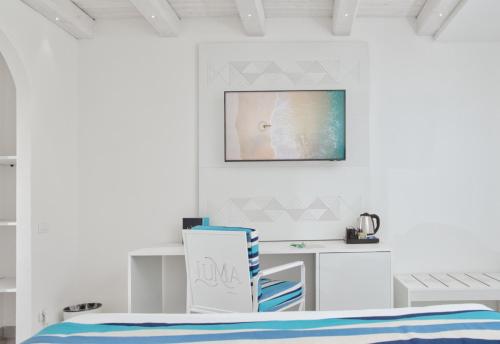 Una cama o camas en una habitación de Luma Relais de Charme