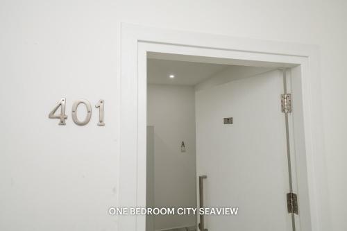 a door to a shower in a bathroom at Lazuli Seaview Apartments 2Bdr in Larnaka
