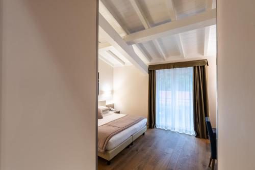 Ein Bett oder Betten in einem Zimmer der Unterkunft Hotel Centrale