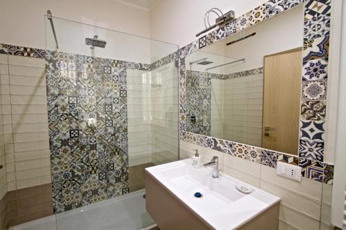 a bathroom with a sink and a shower at La Passeggiata di Girgenti in Agrigento