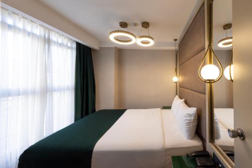 a hotel room with a bed and a window at THE NEST HOTEL in Istanbul