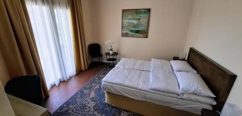 Letto o letti in una camera di La Kascina Suite & Rooms