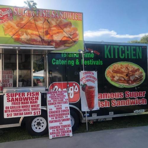 a food truck with signs on the side of it at Vacay Vibes-2 Pools, Pickleball, Coffee Bar, 2 Jacuzzis, Food Truck in Key Largo
