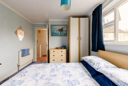 a bedroom with a bed and a dresser and a window at Bed & Breakfast Only - not 24 hour lodging - Truro, Cornwall - free parking in Truro