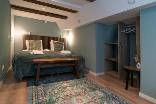 a bedroom with a bed and a rug at 1001 Nights Boutique Lofts in Haarlem