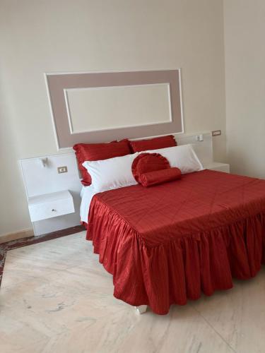 Ένα ή περισσότερα κρεβάτια σε δωμάτιο στο Bernini House Naples