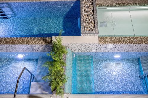 an overhead view of a swimming pool at Pearl SeaBreeze Suites in Rethymno Town