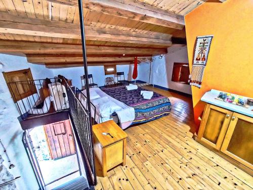 A bed or beds in a room at Case Rurali Pentedattilo