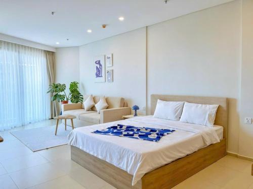 Кровать или кровати в номере The Song Vung Tau Bi Homestay & Spa
