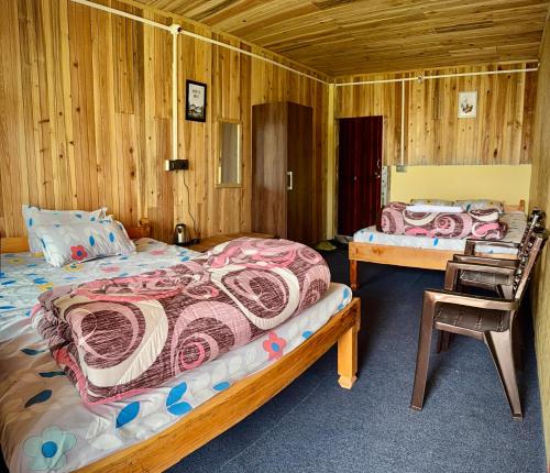 Postel nebo postele na pokoji v ubytování Uncharted Retreats Nomee Homestay