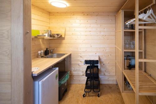 a small kitchen with a sink and a counter at Ptačí domek in Úštěk