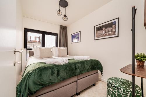 Postel nebo postele na pokoji v ubytování Heritage Suites Antwerp