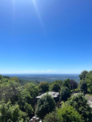 a view from the top of a building in the trees at B&B Villa Mirandola in Brunate