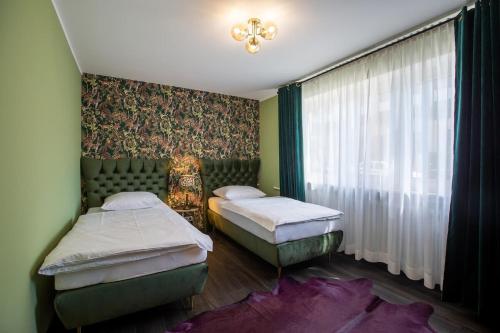 Postel nebo postele na pokoji v ubytování Deluxe-Apartment Frankfurt West