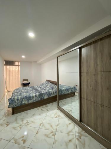 En eller flere senge i et værelse på Appartement haut standing