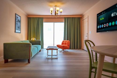 a living room with a couch and a table at Monaco Vacation Rentals in Clearwater Beach