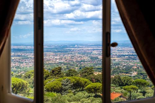 a view of a city from a window at Park Hotel Villa Grazioli in Grottaferrata