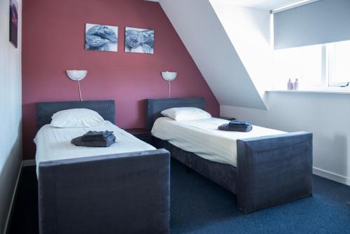 Postel nebo postele na pokoji v ubytování Hotel de Harmonie