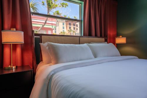 a bedroom with a large bed and a window at Monaco Vacation Rentals in Clearwater Beach