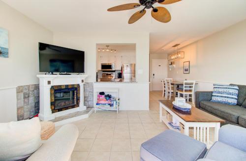 a living room with a couch and a fireplace at Royal Sands I B3: The Sandcastle by Carolina Beach Realty in Carolina Beach
