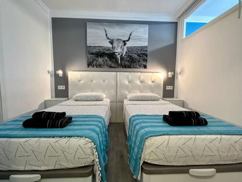 Ένα ή περισσότερα κρεβάτια σε δωμάτιο στο Appartamento moderno centrale WIFI Free b