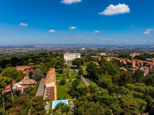 an aerial view of a city with trees and buildings at Park Hotel Villa Grazioli in Grottaferrata