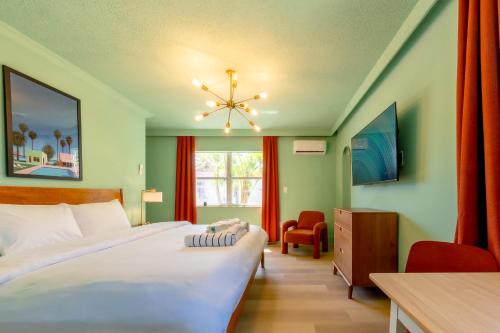 a bedroom with two beds and a window at Monaco Vacation Rentals in Clearwater Beach