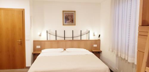 Posteľ alebo postele v izbe v ubytovaní Hotel Cantaleone