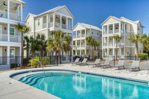 a swimming pool in front of some apartment buildings at Sanity By the Sea by 30A Escapes in Inlet Beach