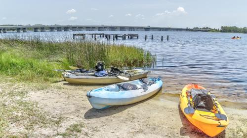 three boats on the shore of a body of water at Sanity By the Sea by 30A Escapes in Inlet Beach