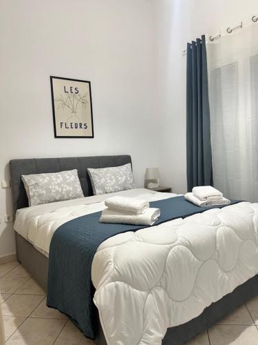two beds sitting next to each other in a bedroom at Ellegant apartment in Politika in Politika